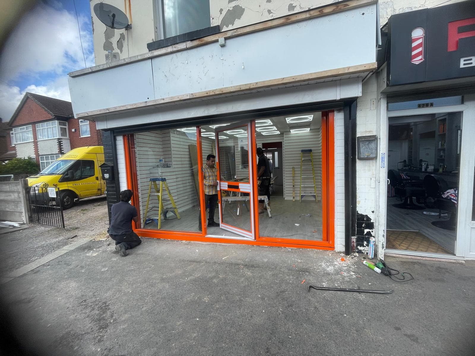 Automatic sliding door installation at commercial entrance