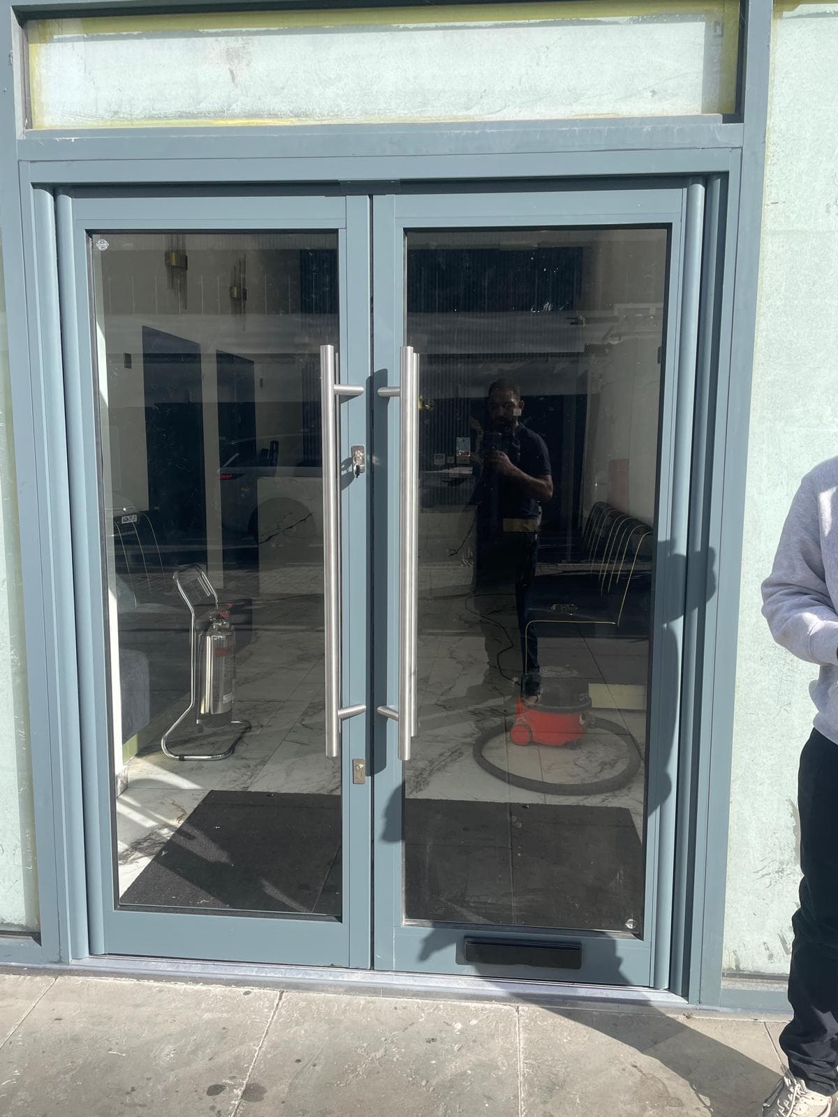 Aluminium bi-fold door system opening to outdoor seating area